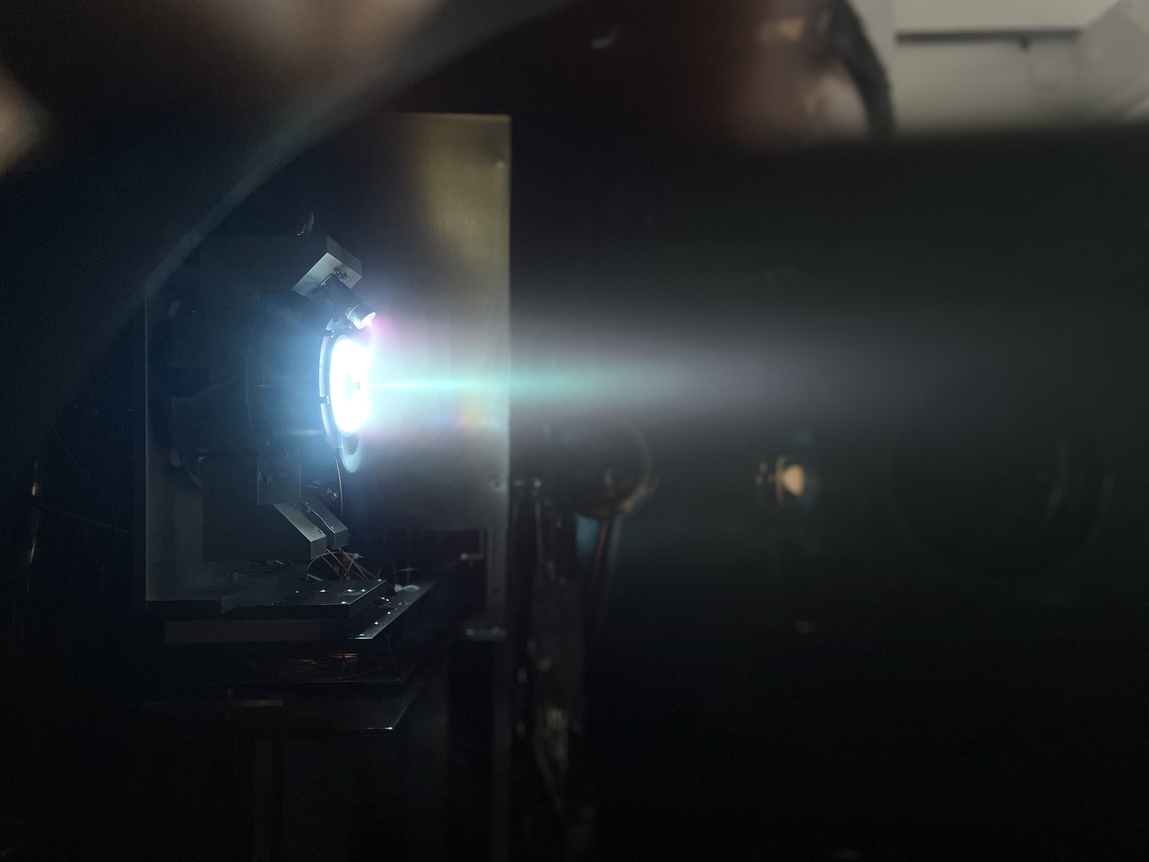 Wide Hall thruster plume firing test in a dark test environment
